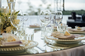 Luxurious restaurant. Luxurious interior, white tables, serving dishes and glasses for guests