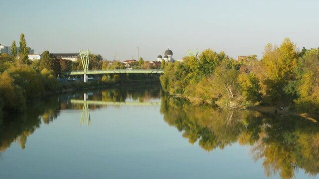 Cityscape of Arad from the distance with the river Mures and the bridge
