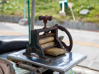 Device for crushing dry squid on Thai stret food tray on food market