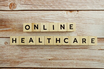 Online Healthcare word alphabet letters on wooden background