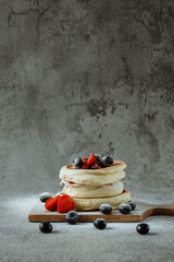 Portrait of typical japanese food called souffle pancakes isolated on cement background with copy...