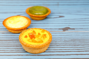 Fototapeta na wymiar Mango tart, Egg tart and Steamed custard tart