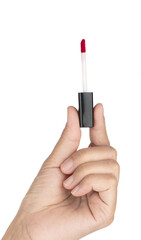 Hand holding brush for make-up lipstick isolated on white background