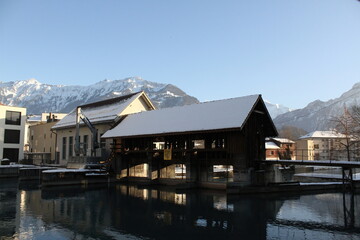 Fototapeta na wymiar Covered Bridge in Aare River, Interlaken, Switzerland, in Winter.