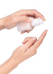 Hand holding Foundation cosmetic bottle isolated on white background.