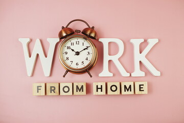 Work from Home alphabet letters with alarm clock on pink background