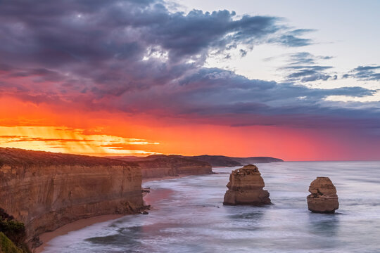 Australia, Victoria, View of Twelve Apostles and Gibson Steps in Port Campbell National Park at dramatic dawn