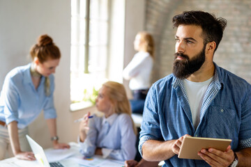 Obraz premium Group of multiethnic business people working at the office. Startup finance teamwork concept