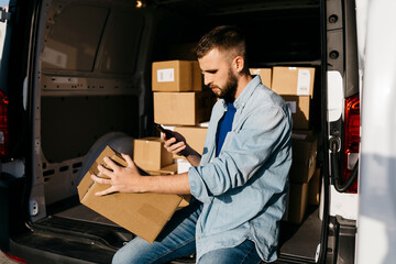 Delivery person scanning package in van