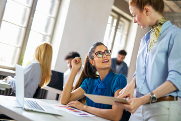 Portrait of business women working together in corporate office. Finance architect startup concept