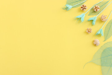 Top view image of forest natural composition over yellow background .Flat lay