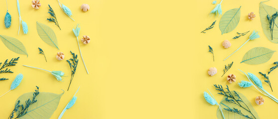 Top view image of forest natural composition over yellow background .Flat lay