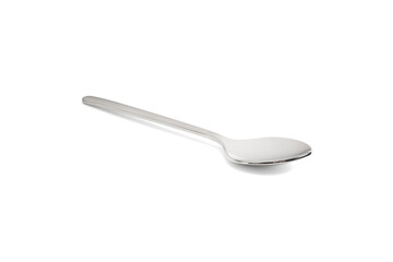 Clean shiny metal spoon isolated on white. Stainless steel small kitchen dessert teaspoon cut close up. Tablespoon. Kitchen utensils concept
