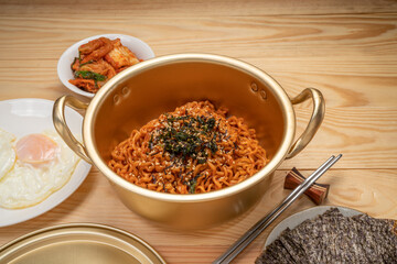 Super Spicy Korean noodles, Ramyun or hot ramen Korean dry noodles food, Korean style instant ramen spicy served with fried egg.