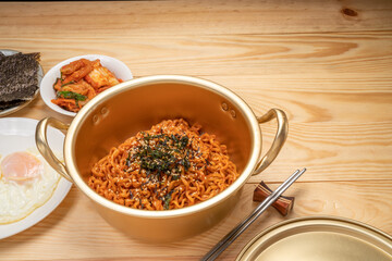Super Spicy Korean noodles, Ramyun or hot ramen Korean dry noodles food, Korean style instant ramen spicy served with fried egg.