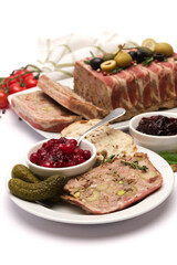 Traditional French terrine covered with bacon isolated on white background