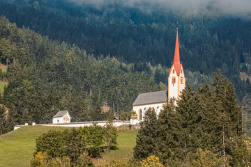 Beautiful alpine summer view with a church near Strassen, Tyrol, Austria