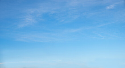 bright blue sky with light haze clouds