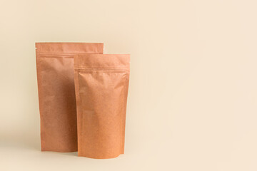 Pouch bag mockup neutral beige background monochrome. Merchandise packaging Blank brown kraft paper...