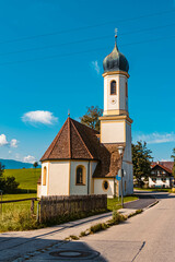Fototapeta na wymiar Beautiful church on a sunny summer day near the famous Riegsee lake, Bavaria, Germany
