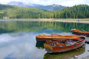 Boats in the water. Black Lake or Crno Jezero. National park Durmitor Mouintains in Montenegro