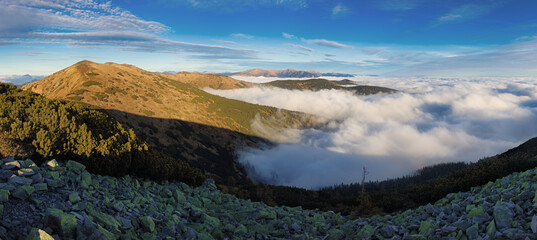 Fototapeta premium Mountainous landscape with hills and valleys at a sunny day in autumn season. The Low Tatras National Park in Slovakia, Europe.