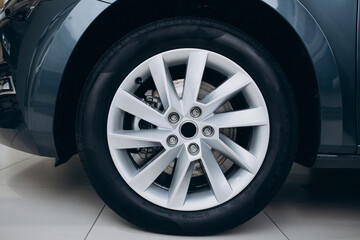 Obraz premium Car wheel with new tires close up