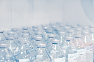 Medical solution for treatment in bottles. Dropper preparations. Medical device for emergency patient in blue tone style. Blank Emergency Surgery Room. Clinic interior for background