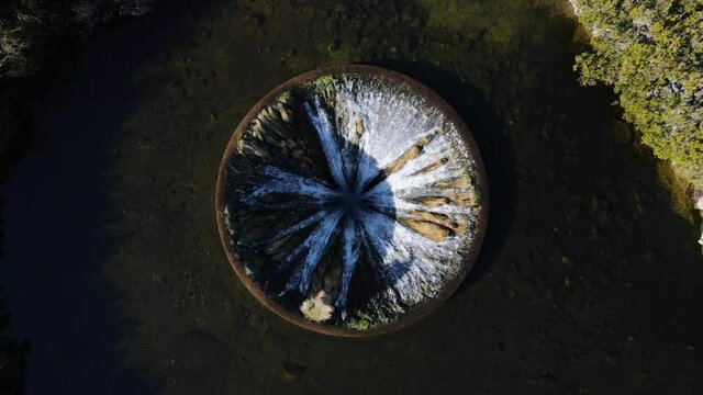Aerial birds eye view of Cov&atilde;o dos Conchos. A unique drainage system on a lake in the Serra da Estrela mountain in Portugal.