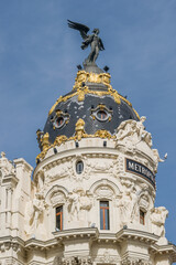Fototapeta na wymiar Dome of the Metropolis building, in Madrid, Spain. Eclectic style building opened in 1911.