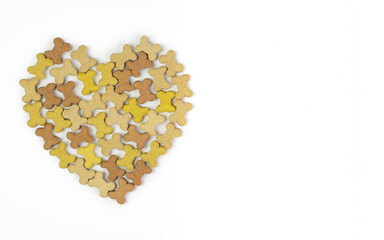 Dried food for dog puppy, with a shape of heart on white background .Valentines day concept .
