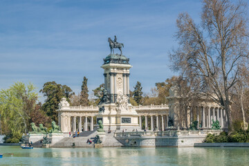 Monument to Alfonso XII in the pond of El Retiro Park, Madrid, Spain. Built in 1922. - obrazy, fototapety, plakaty