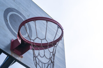 Low angle view of basketball hoop under the morning sunlight
