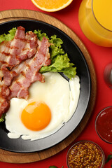 Concept of tasty breakfast on red background