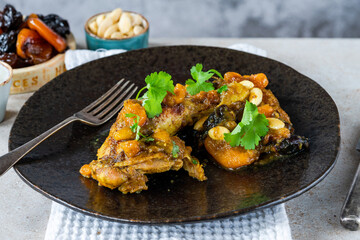 Chicken leg tagine with caramelised prunes and apricots and roasted almonds