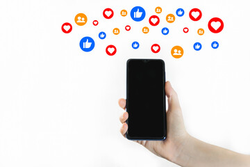 Woman hand holding empty screen cell phone using social media giving likes.Mock up promo social...