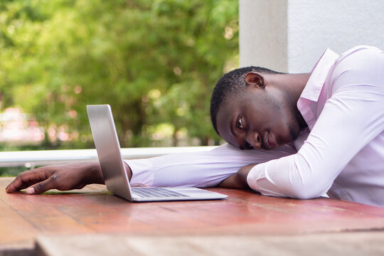 Exhausted And Hopeless Black African Business Man, Concept Of Slow Internet Connection, Internet Scam, Job Problem, Pay Cut, Layoff