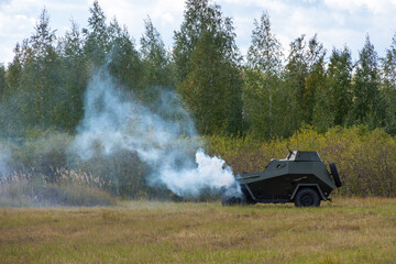 A burning, smoking armored vehicle. Reconstruction of the battle of World War II. Russia, Chelyabinsk region, September 12, 2021 Victory Day.