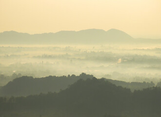 Amazing Sunrise Over Misty Landscape. Scenic View Of Foggy Morning Sky With Rising Sun Above Misty Forest