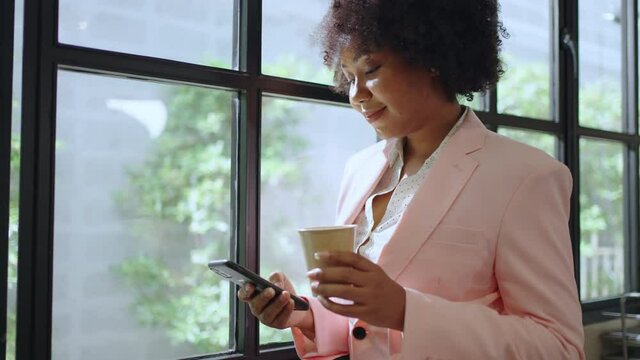 African Female enjoy call,online chat,internet purchase, browse web, download new freeware application.African woman hands typing message on smart phone in application for business correspondence.