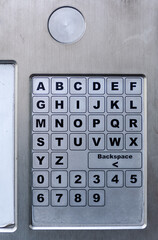 Alphabets and number touch keyboard from the automatic parking machine on the city pavement