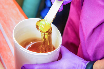 Lollypaste, shugar paste on the stick. Professional hair removal