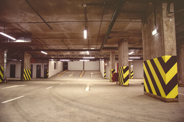 Empty parking place in a residential building. Covered underground parking for cars