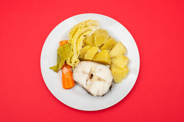 boiled fish with boiled potato, carrot and cabbage