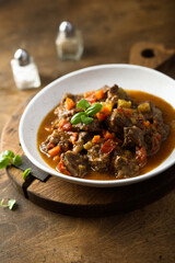 Beef ragout with vegetables and basil