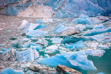 Pieces of blue ancient ice in water. Perito Moreno glacier in Patagonia. Floe located in Los Glaciares National Park, in the southwest of the Argentine province of Santa Cruz, El Calafate