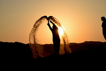 silhouette of a person in sunset