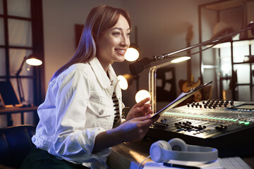 Woman working as radio host in modern studio