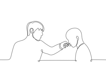 young man feeding from a spoon or giving medicine to bald child - one line drawing vector. care, treatment and feeding concept in chemotherapy