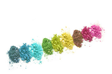 Rainbow colors eye shadow, crushed cosmetic isolated on white background. A smashed, bright toned eyeshadow make up palette
